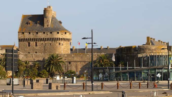 Explore the medieval charm of Saint-Malo's iconic fortifications bathed in sunlight.