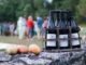 Bottles of Mercurey wine and apples on a rustic setting in Bourgogne, France.